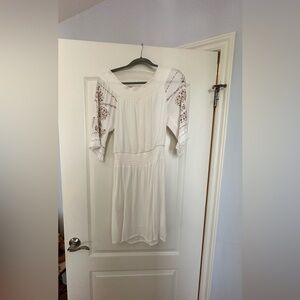 White dress with embroidered sleeves